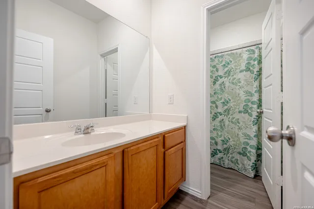 a bathroom with a sink and a mirror