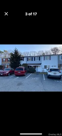 a view of kitchen with kitchen island sink and refrigerator