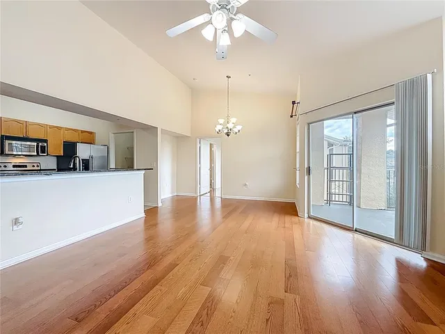 a kitchen with stainless steel appliances granite countertop a refrigerator sink and microwave