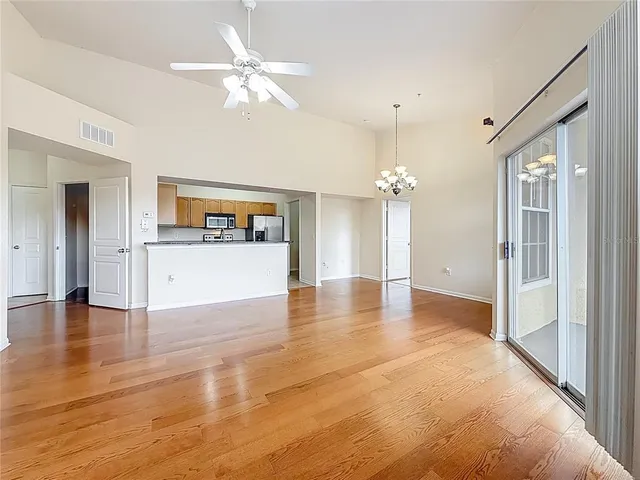 a kitchen with stainless steel appliances granite countertop a sink a counter space and cabinets