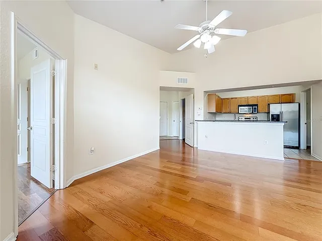 a kitchen with granite countertop cabinets stainless steel appliances and a sink