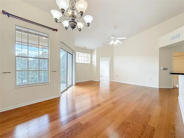 a kitchen with stainless steel appliances granite countertop a refrigerator stove and sink