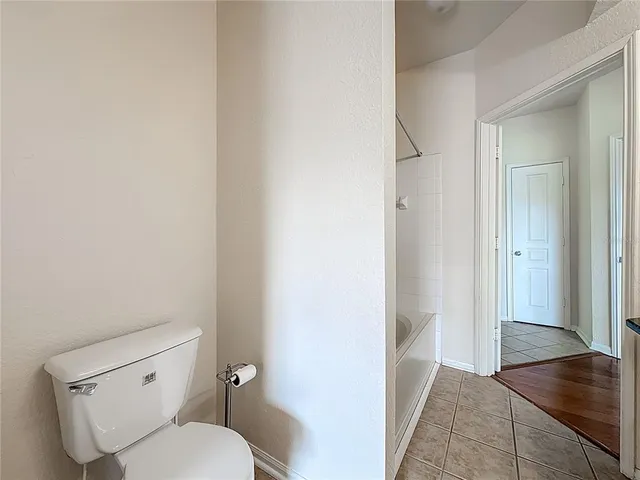a bathroom with a granite countertop sink a mirror a shower and a shower
