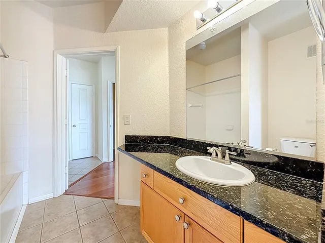a bathroom with a shower and a toilet
