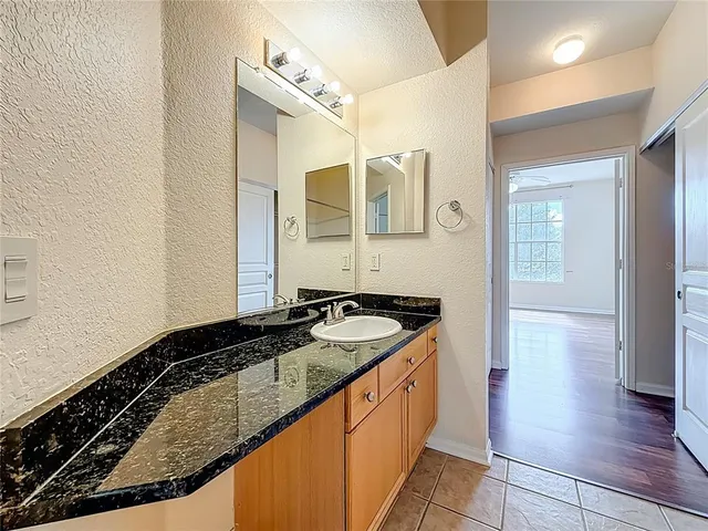 a bathroom with a toilet and a large window