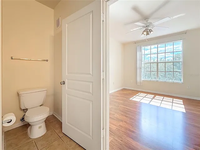 a aerial view of a house with a yard table and chairs