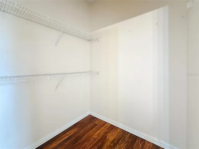 an aerial view of a house with a garden and swimming pool