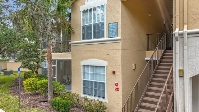 a view of a kitchen with wooden floor and a kitchen space