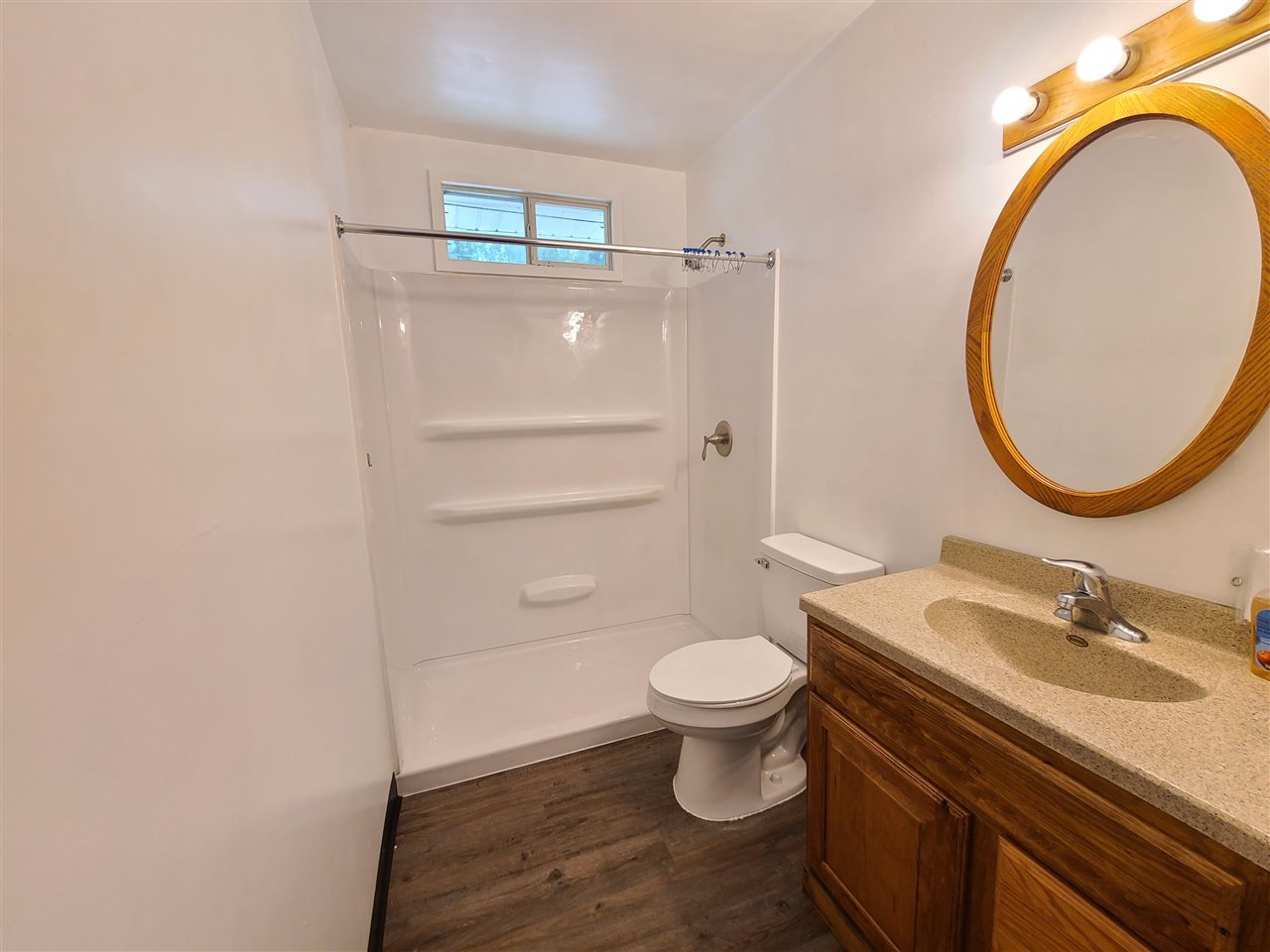 528 North 12th Street Rochelle, IL 61068 - Photo 11 of 16 a bathroom with a sink toilet a mirror and vanity