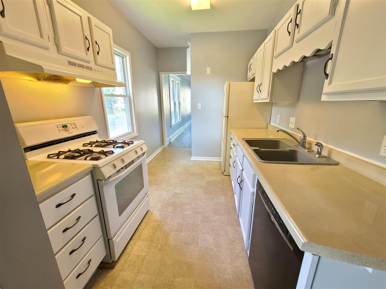 528 North 12th Street Rochelle, IL 61068 - Photo 2 of 16 a kitchen with stainless steel appliances granite countertop a sink stove and refrigerator