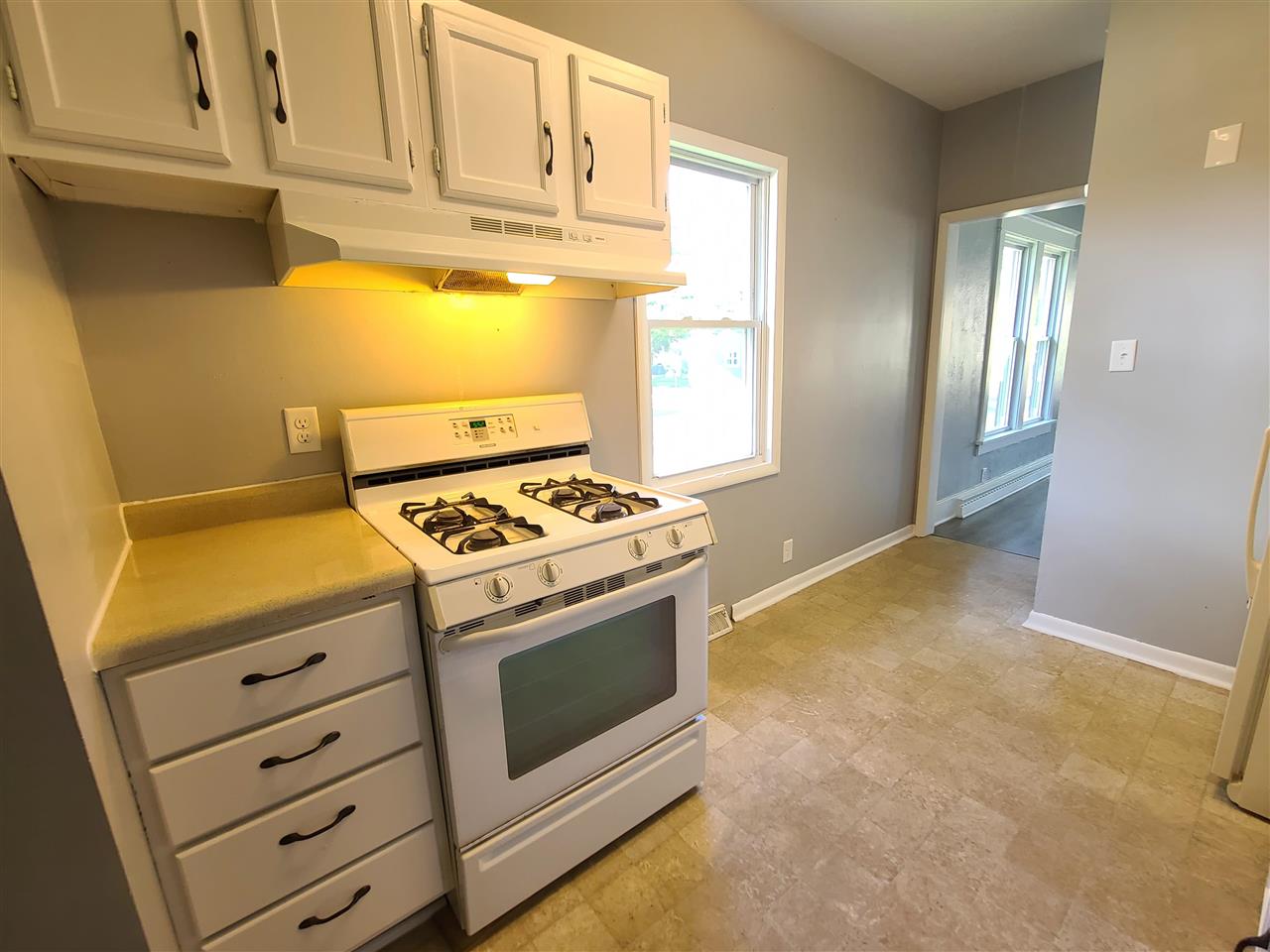 528 North 12th Street Rochelle, IL 61068 - Photo 3 of 16 a stove top oven sitting inside of a kitchen