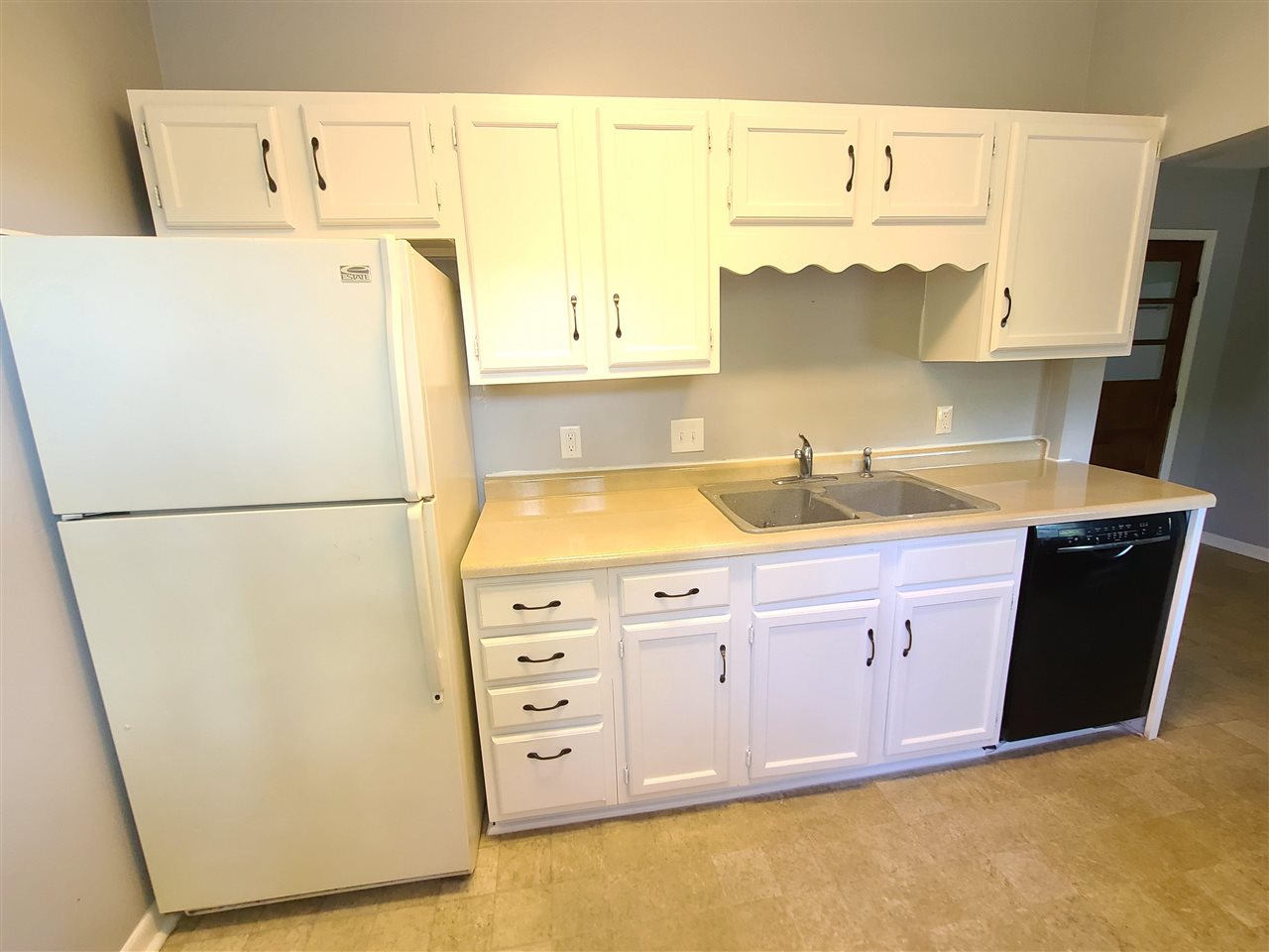 528 North 12th Street Rochelle, IL 61068 - Photo 4 of 16 a kitchen with cabinets a refrigerator and a sink