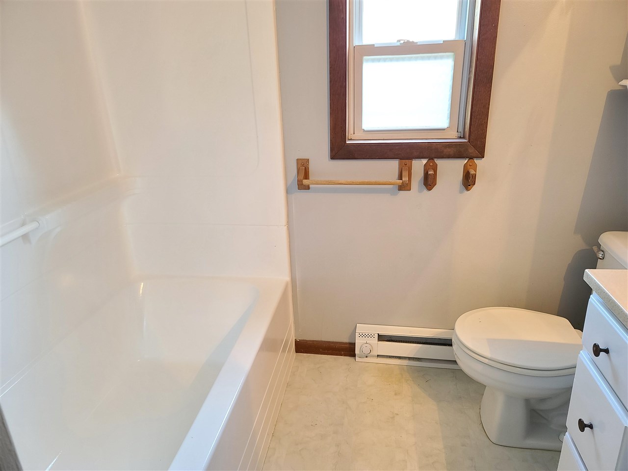 528 North 12th Street Rochelle, IL 61068 - Photo 10 of 16 a bathroom with a toilet a sink and a window