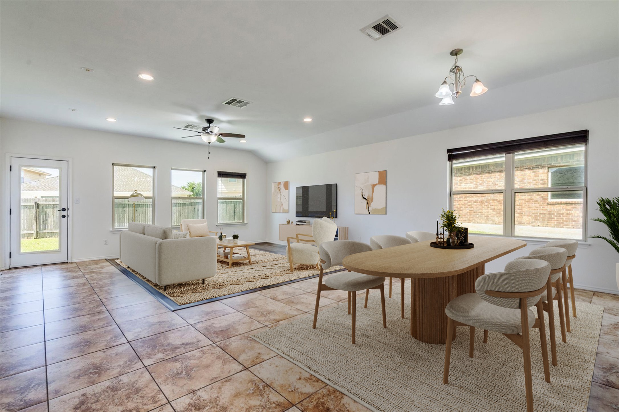 16829 Ruggio Road Pflugerville, TX 78660 - Photo 8 of 40 a living room with furniture a chandelier and a table