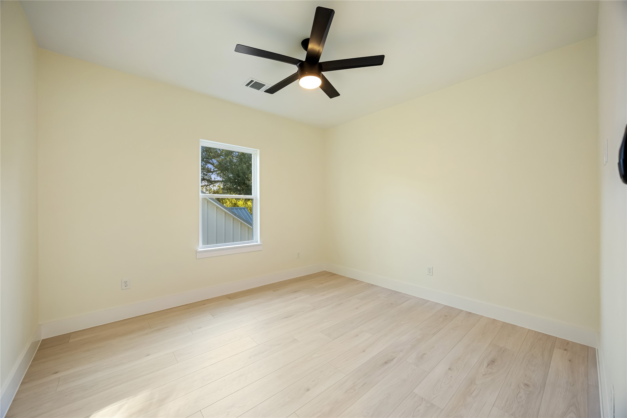7125 England Street Houston, TX 77021 - Photo 13 of 28 a view of room with a ceiling fan and window