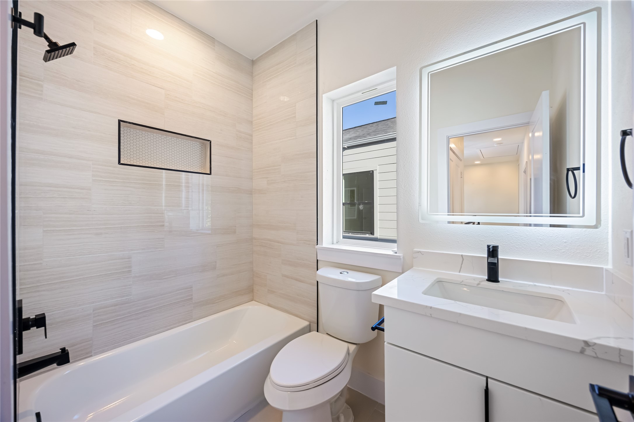 7125 England Street Houston, TX 77021 - Photo 18 of 28 a bathroom with a sink a toilet and shower