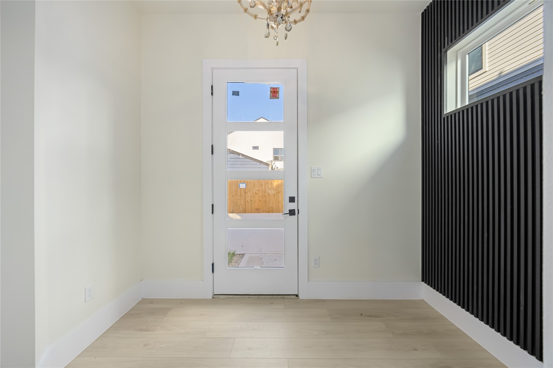 7125 England Street Houston, TX 77021 - Photo 2 of 28 an empty room with a door and a window