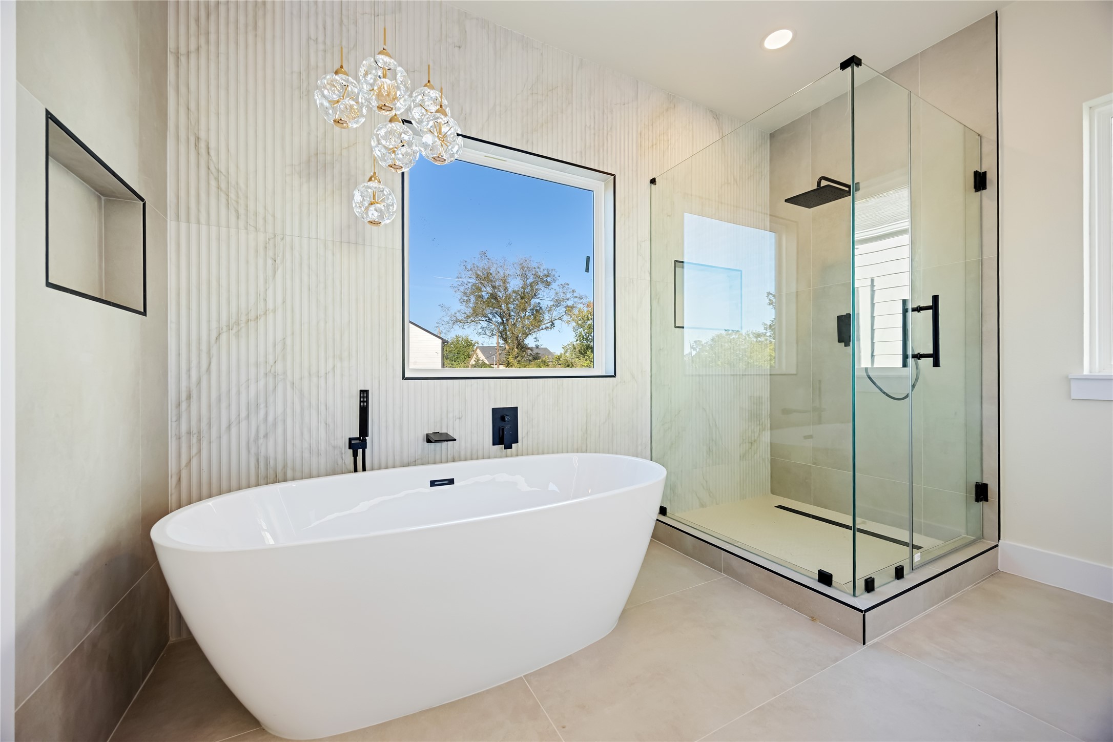 7125 England Street Houston, TX 77021 - Photo 23 of 28 a white bath tub sitting next to a bathroom