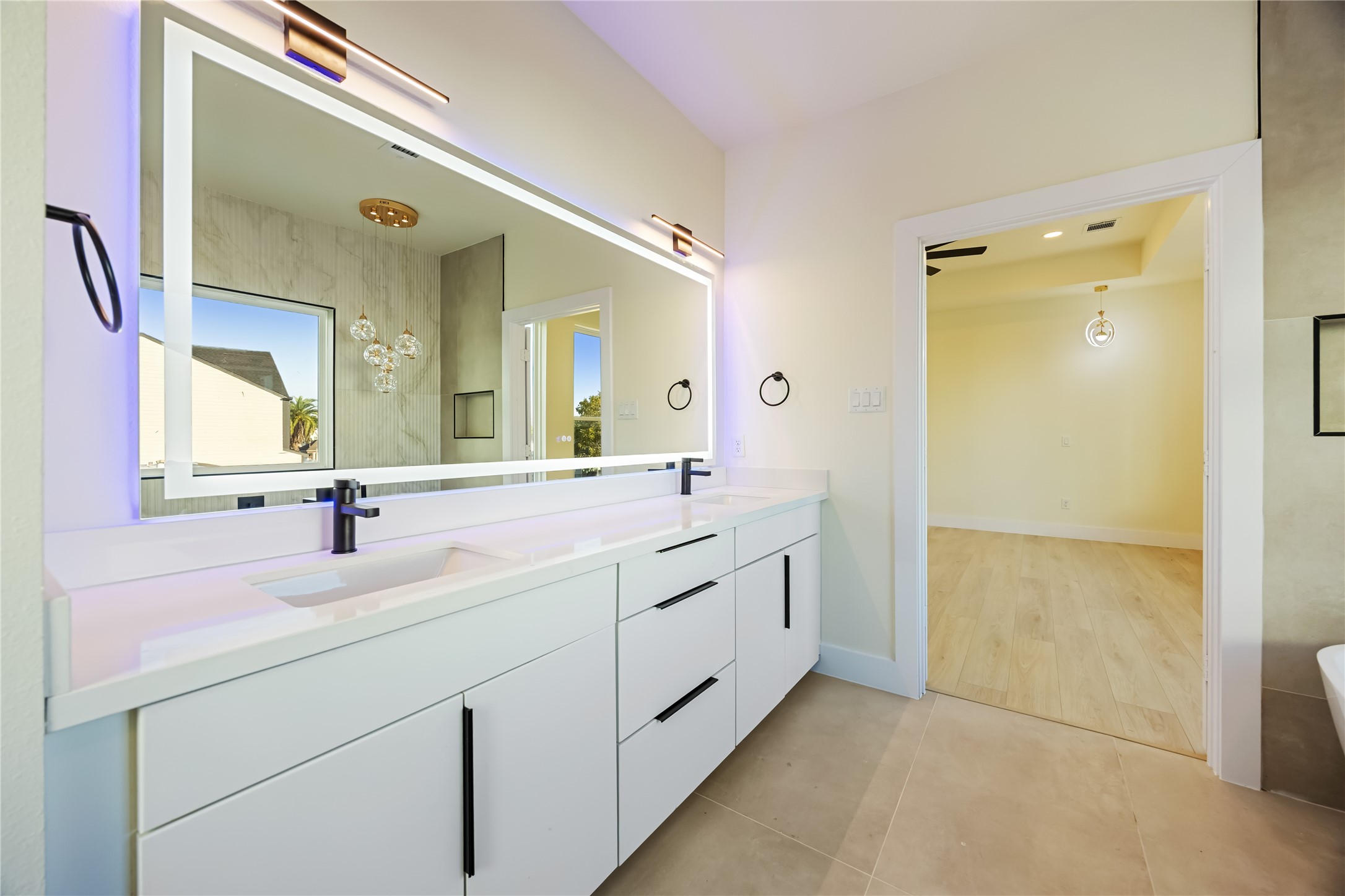 7125 England Street Houston, TX 77021 - Photo 25 of 28 a bathroom with a double vanity sink mirror and