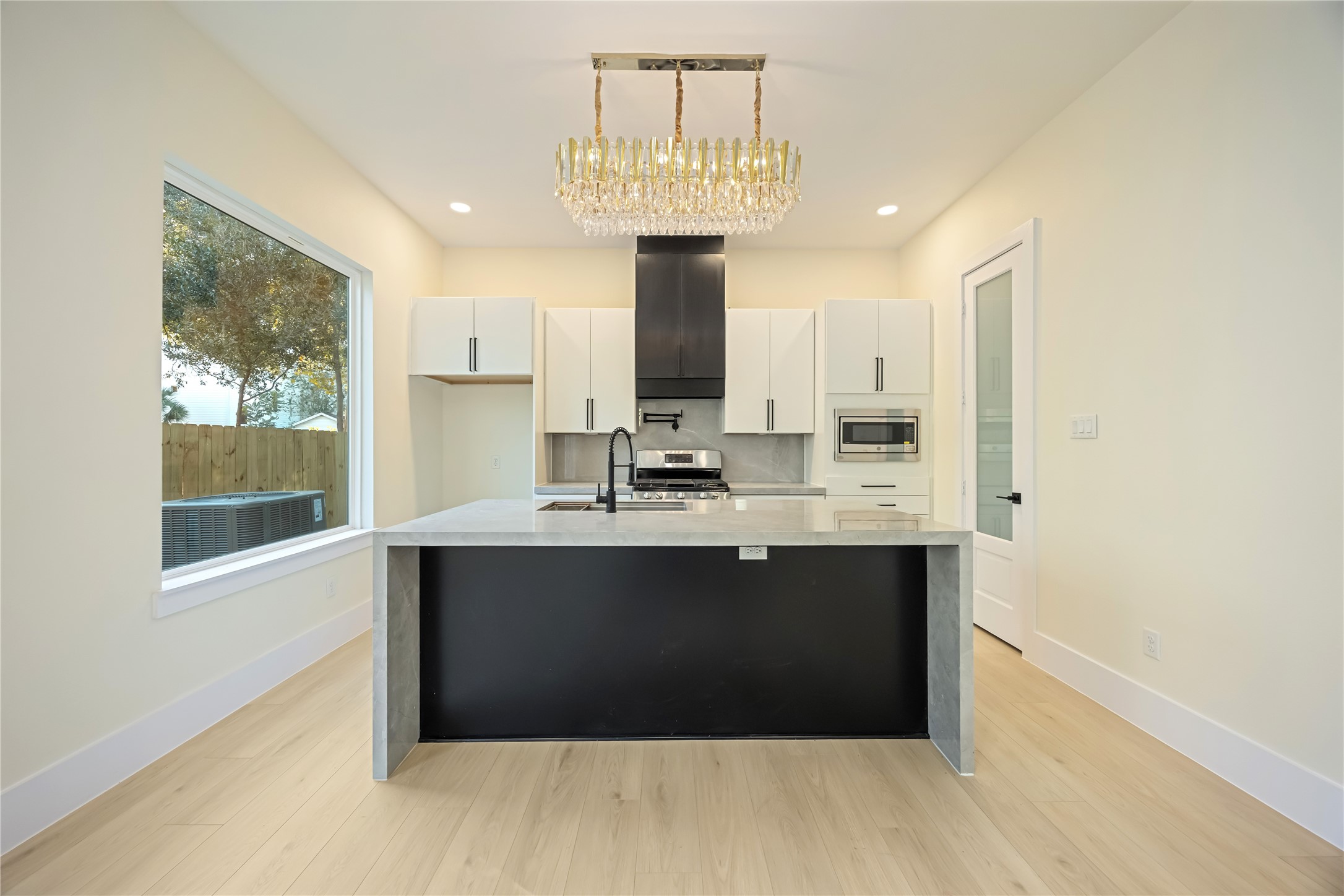 7125 England Street Houston, TX 77021 - Photo 7 of 28 a kitchen with a sink cabinets and window