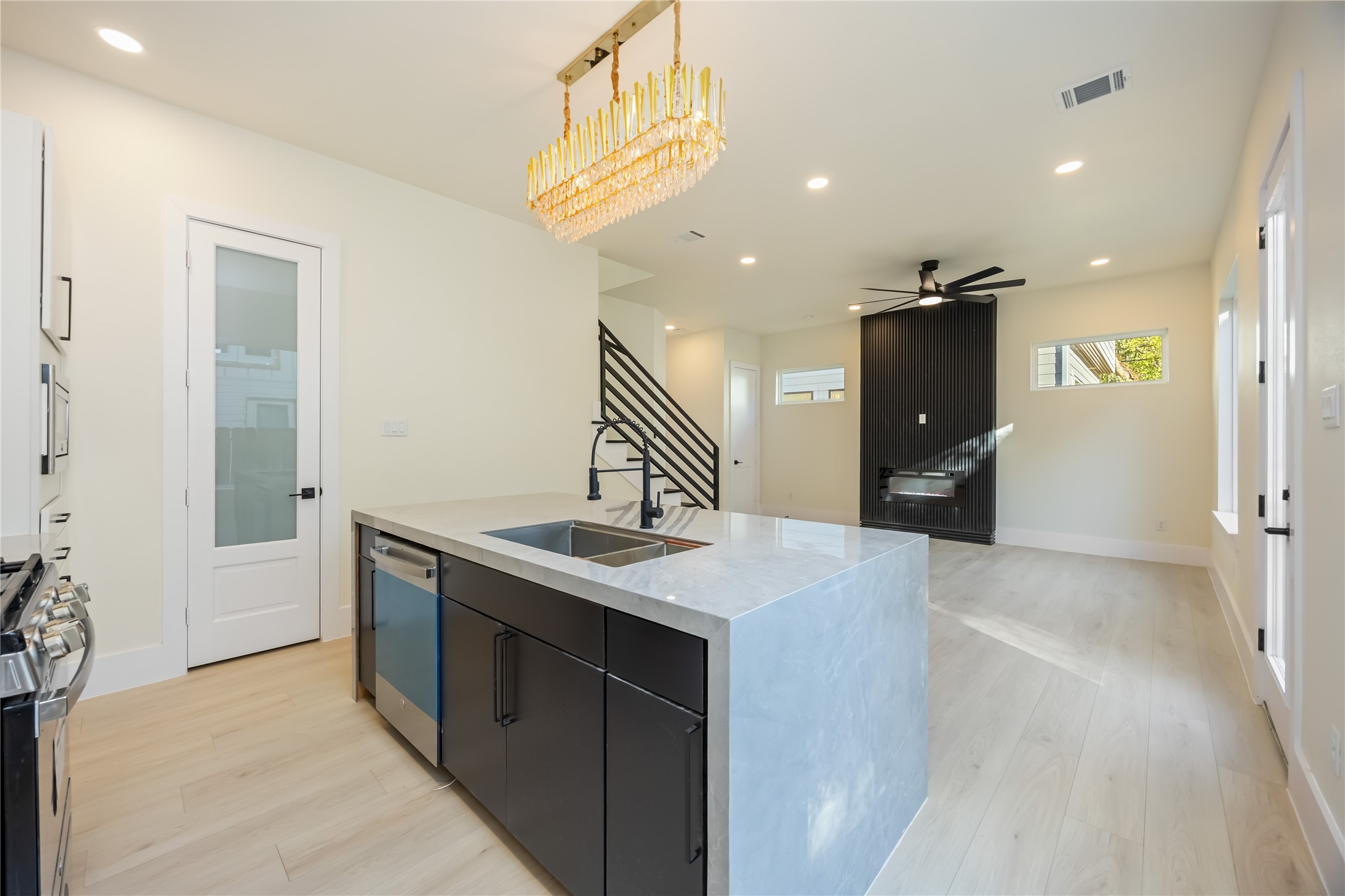 7125 England Street Houston, TX 77021 - Photo 9 of 28 a kitchen with a sink and a refrigerator