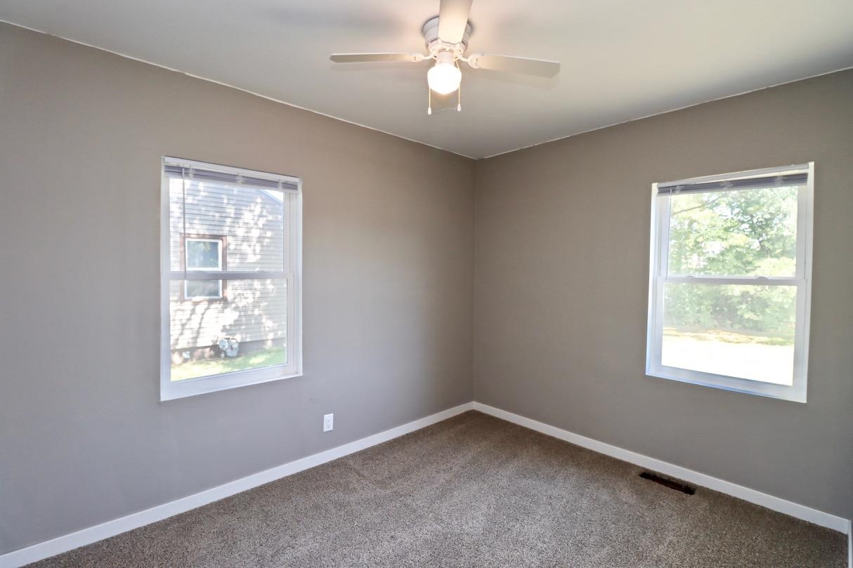 2228 Magnolia Rockford, IL 61104 - Photo 4 of 8 a view of an empty room with a window