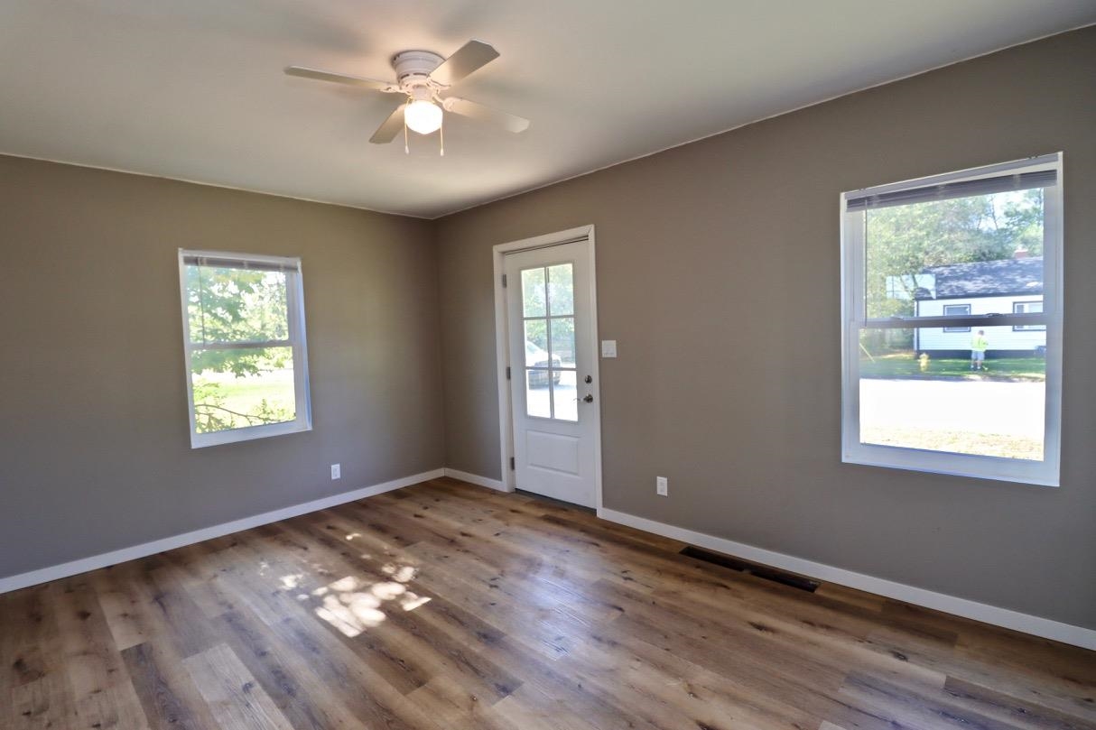 2228 Magnolia Rockford, IL 61104 - Photo 7 of 8 a view of an empty room with window and wooden floor