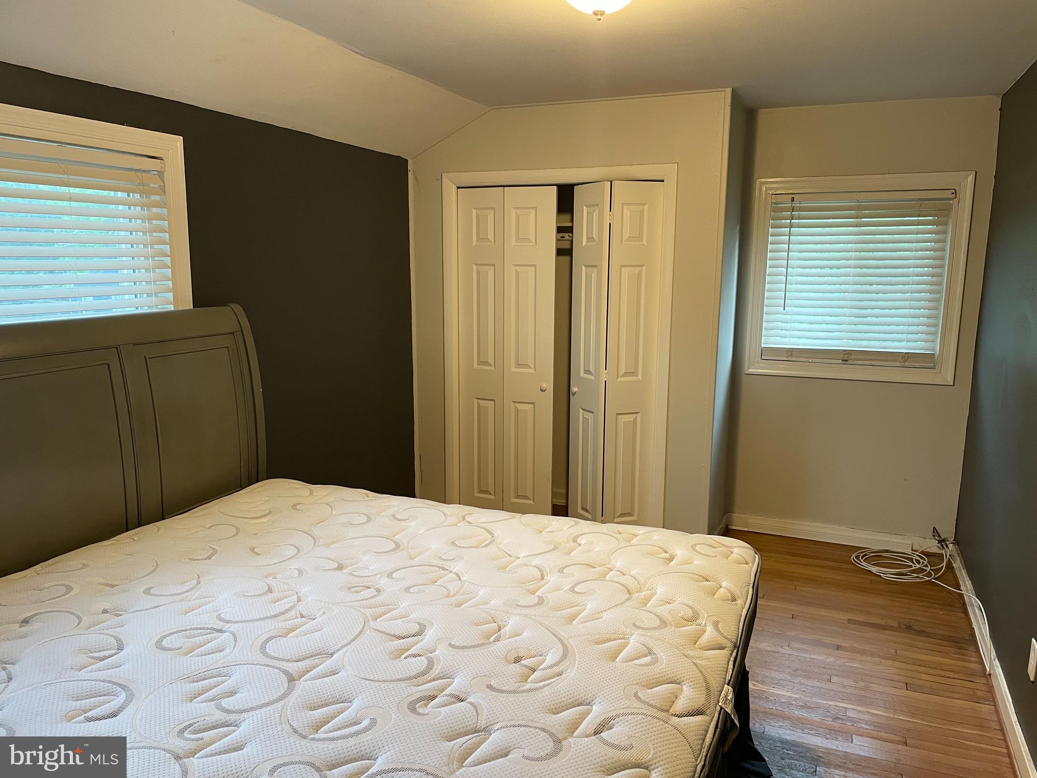 2307 Wyngate Road Suitland, MD 20746 - Photo 19 of 22 a bedroom with a bed and wooden floor