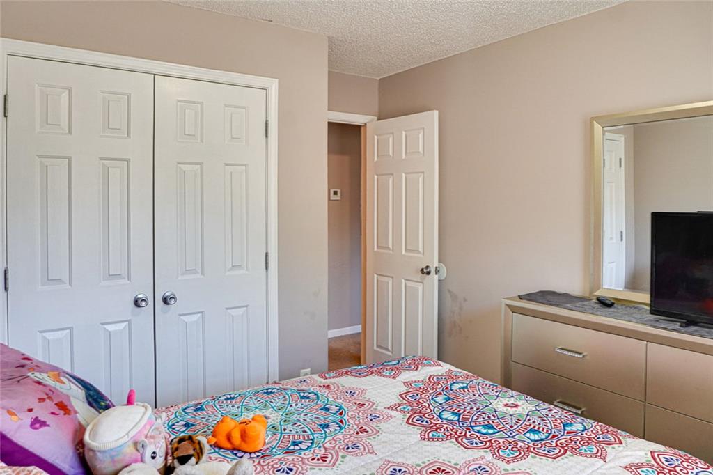 7071 Galloway Point Riverdale, GA 30296 - Photo 16 of 22 a bedroom with a bed and a window