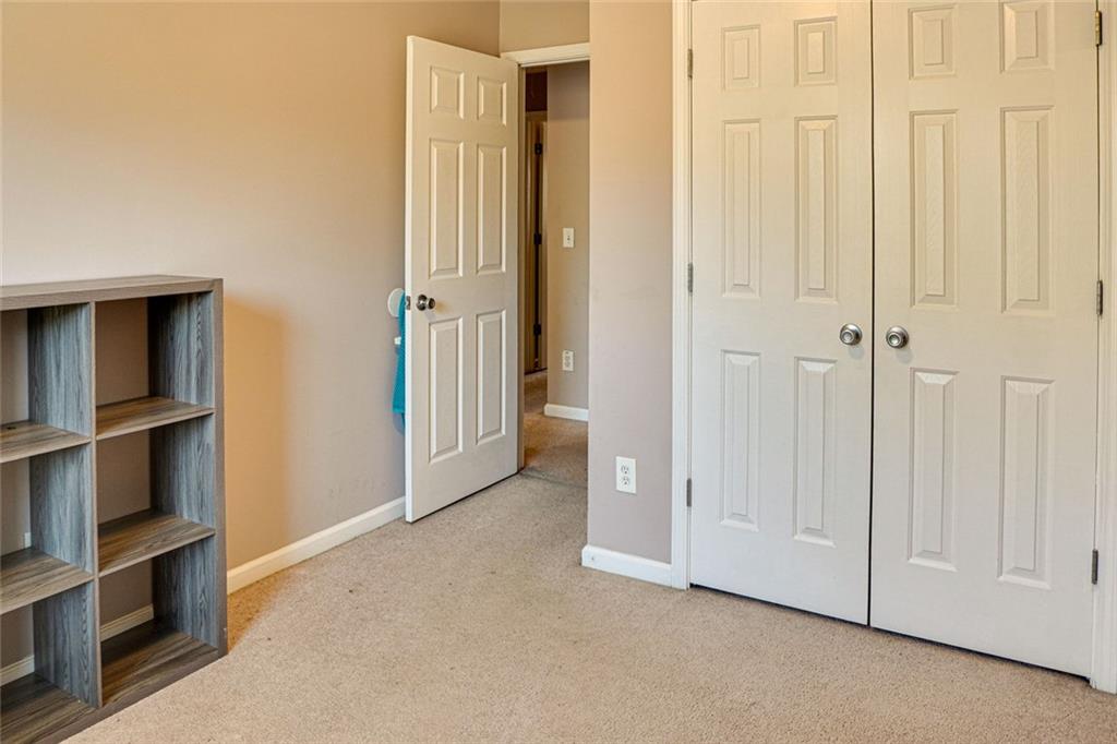 7071 Galloway Point Riverdale, GA 30296 - Photo 17 of 22 a view of an empty room and closet area