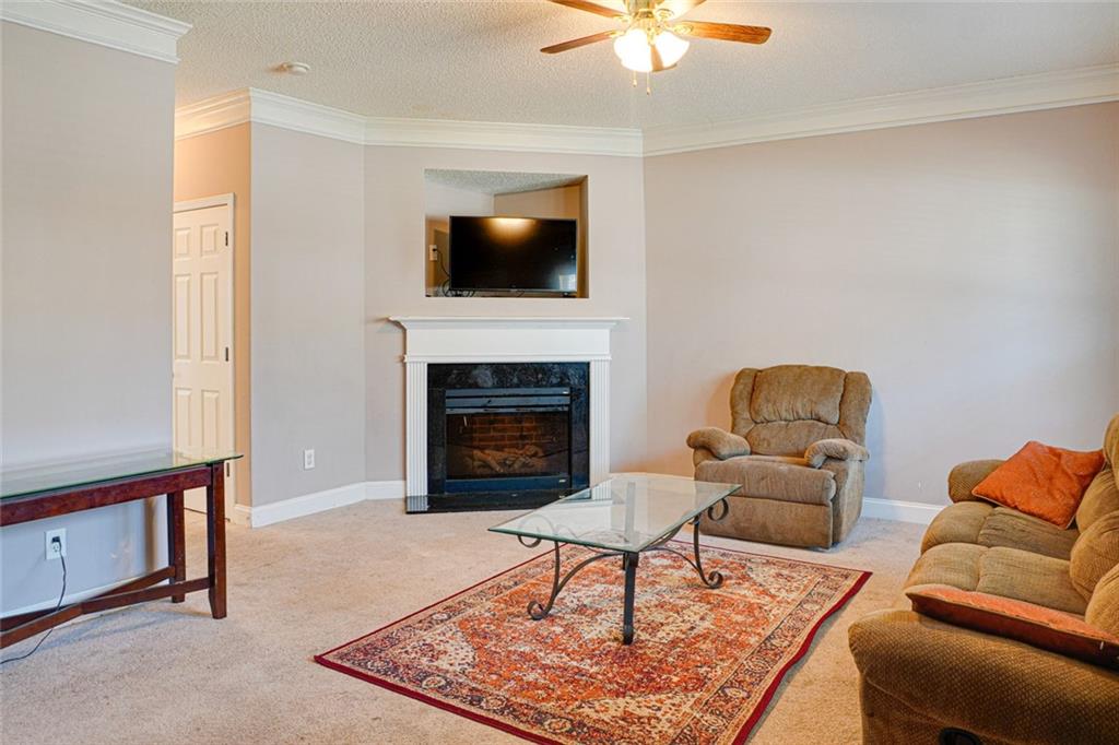 7071 Galloway Point Riverdale, GA 30296 - Photo 3 of 22 a living room with furniture and a fireplace