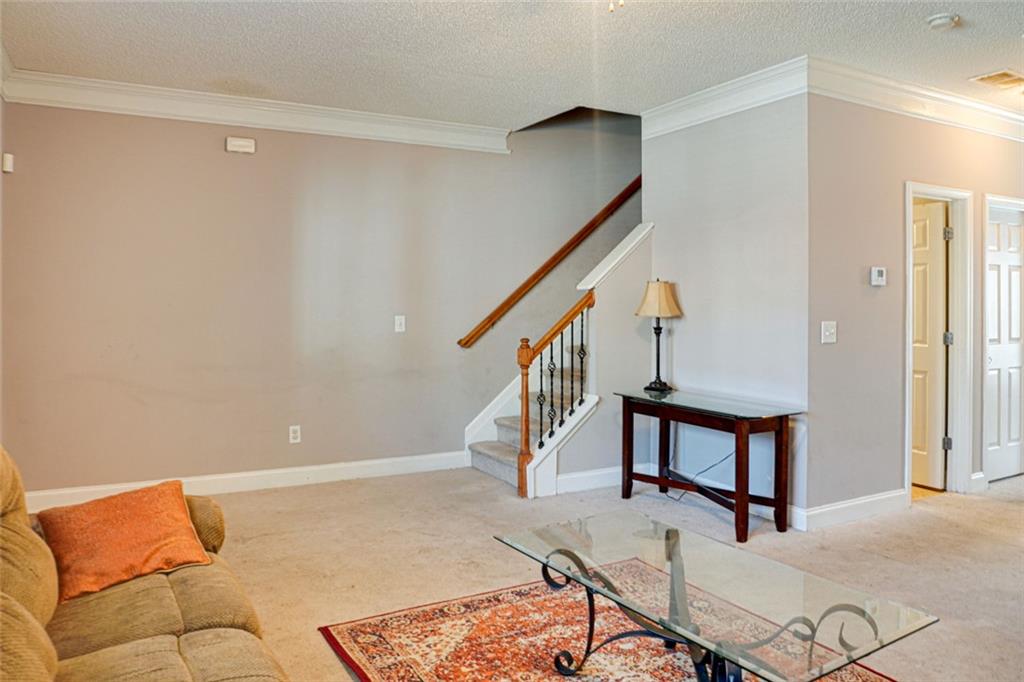 7071 Galloway Point Riverdale, GA 30296 - Photo 4 of 22 a bedroom with furniture and a window