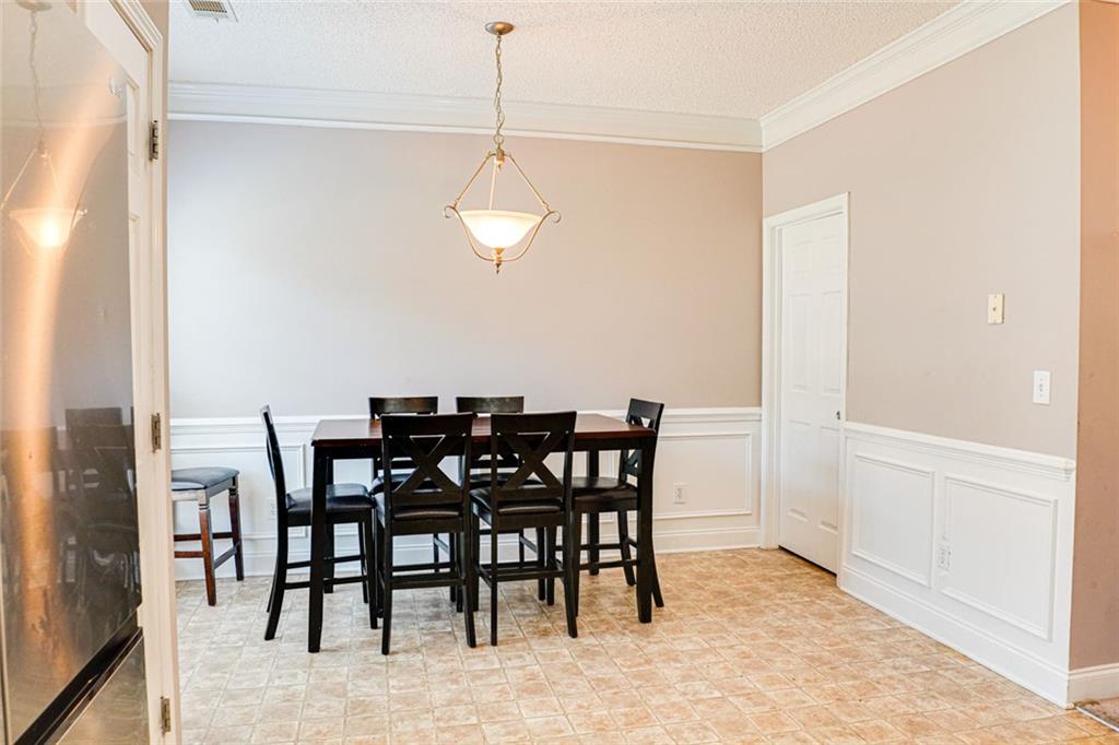 7071 Galloway Point Riverdale, GA 30296 - Photo 8 of 22 a view of a dining room with furniture