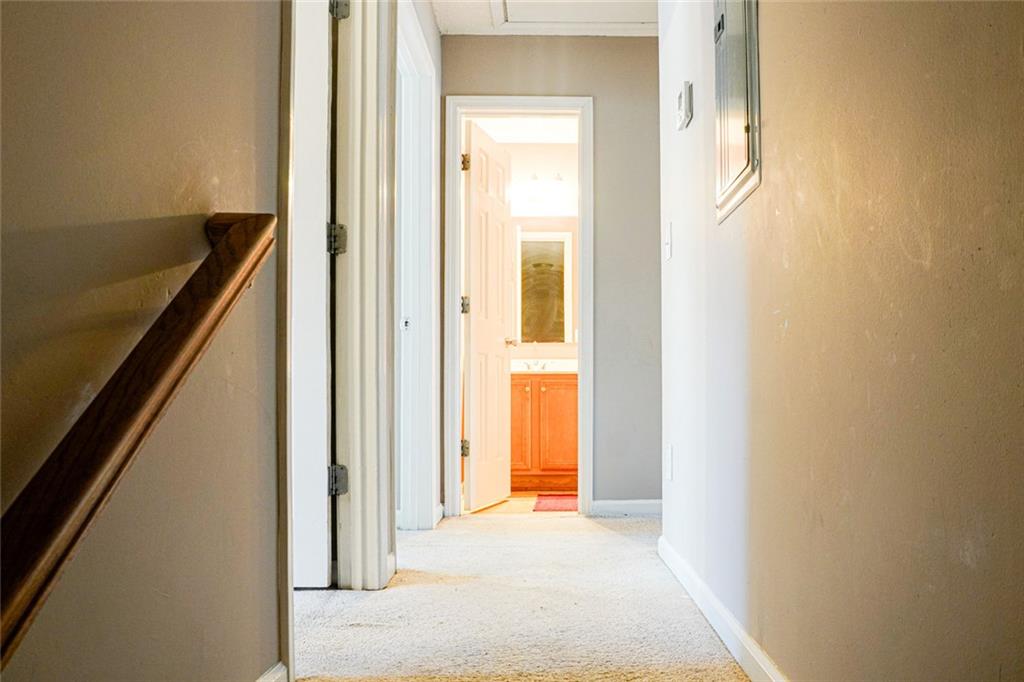 7071 Galloway Point Riverdale, GA 30296 - Photo 9 of 22 a view of a hallway with wooden floor and staircase