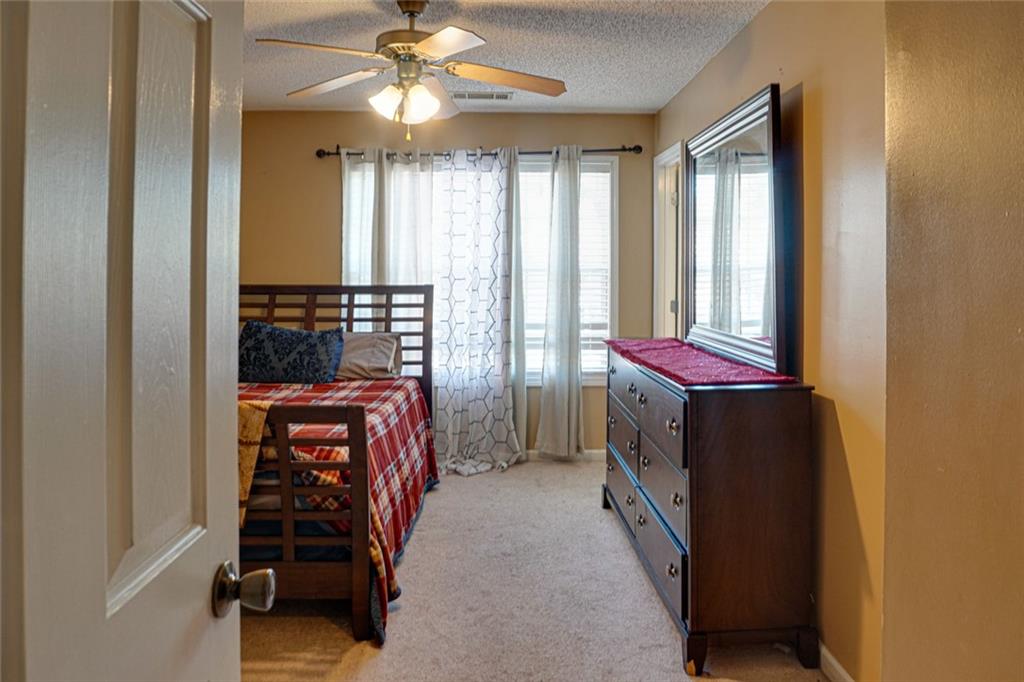 7071 Galloway Point Riverdale, GA 30296 - Photo 10 of 22 a view of a livingroom with furniture and staircase