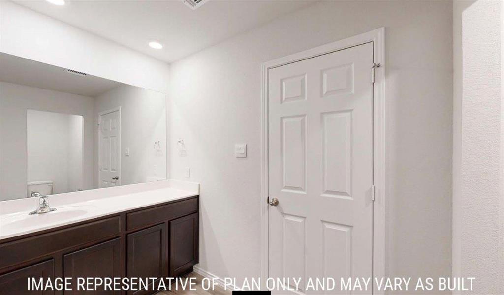 10225 Altair Drive Waco, TX 76708 - Photo 10 of 13 a bathroom with a sink and a mirror