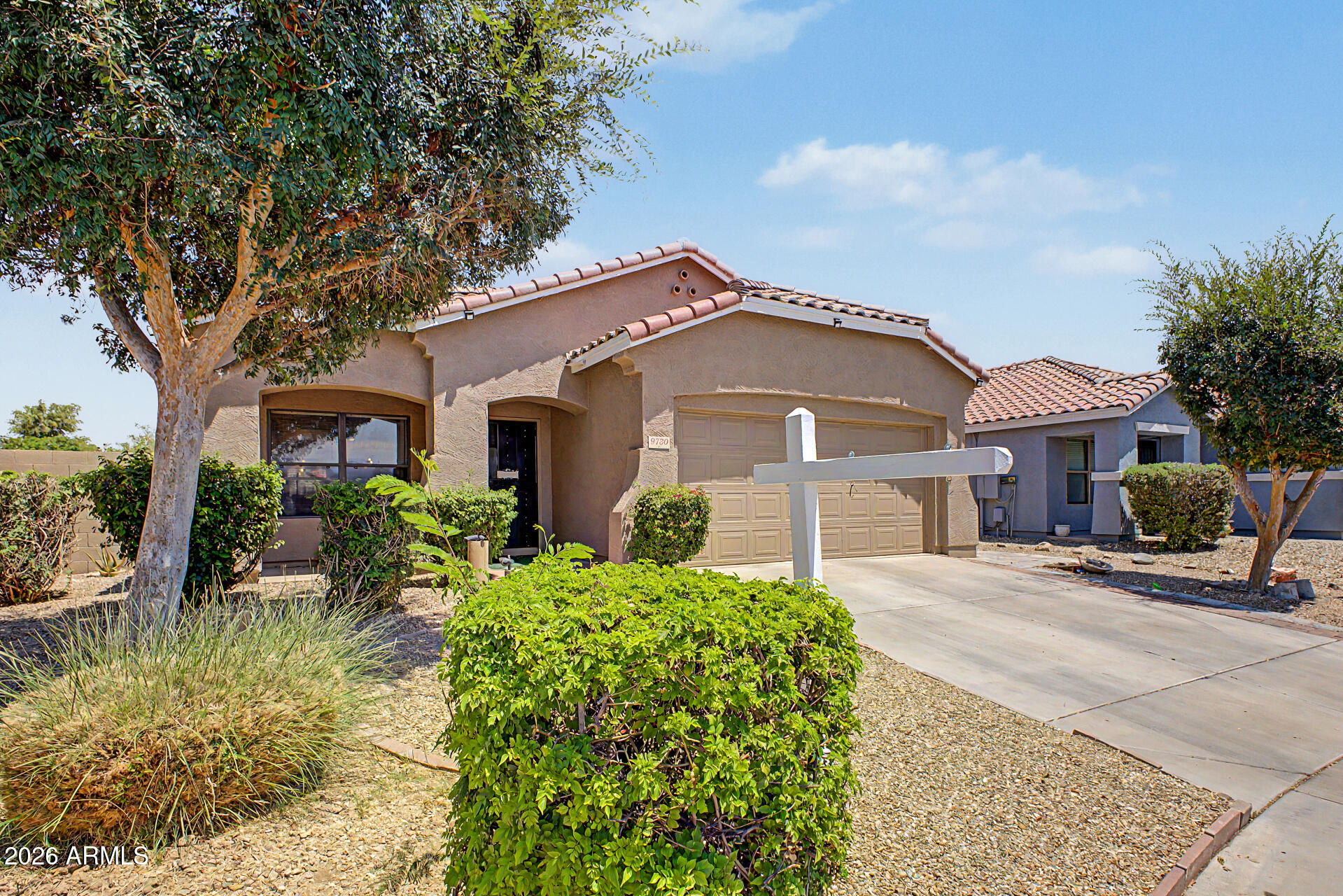 9730 West Payson Road Tolleson, AZ 85353 - Photo 6 of 57 a front view of a house with a yard