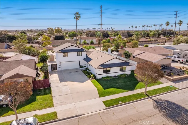 a view of multiple houses with a yard