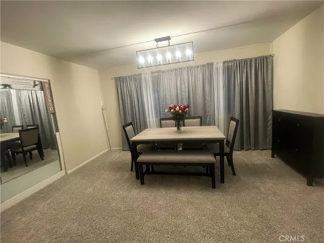 a bedroom with furniture and a chandelier