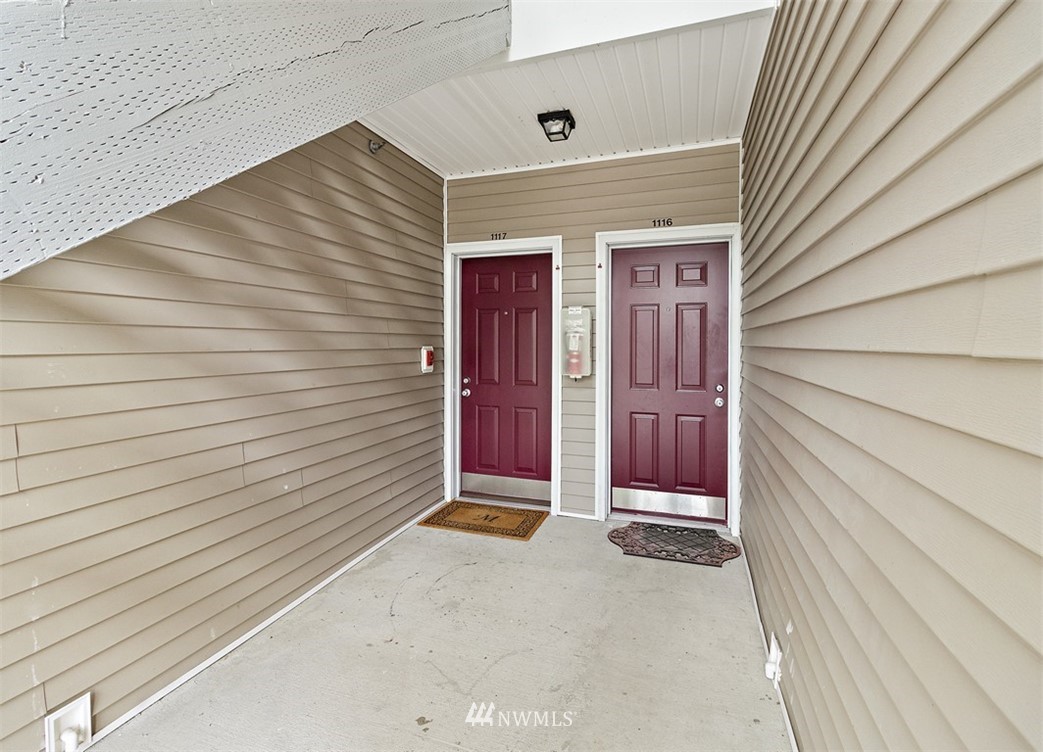 3012 Southeast 8th Place, Unit 1117 Renton, WA 98058 - Photo 3 of 40 a view of front door of a house