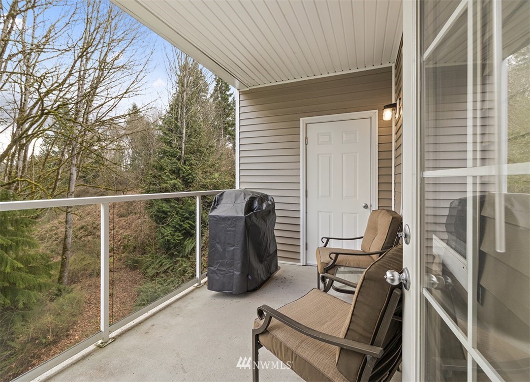 3012 Southeast 8th Place, Unit 1117 Renton, WA 98058 - Photo 25 of 40 a view of workspace with wooden floor and windows