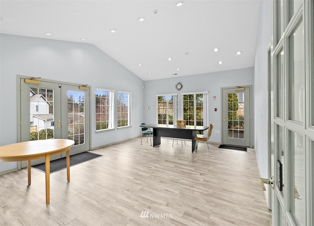 3012 Southeast 8th Place, Unit 1117 Renton, WA 98058 - Photo 31 of 40 a living room with furniture and a large window