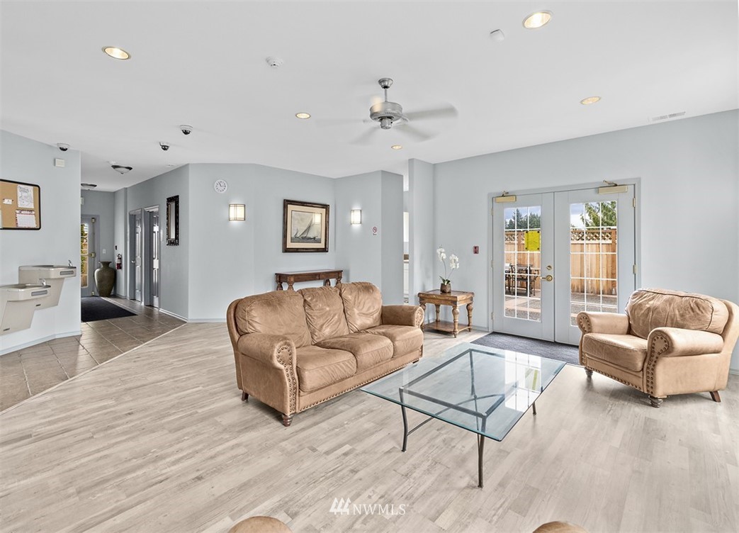 3012 Southeast 8th Place, Unit 1117 Renton, WA 98058 - Photo 35 of 40 a living room with furniture and a large window