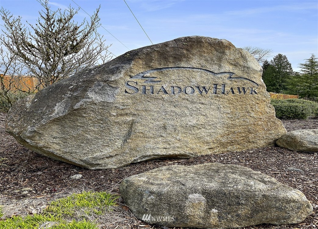 3012 Southeast 8th Place, Unit 1117 Renton, WA 98058 - Photo 40 of 40 a sign on the side of a road