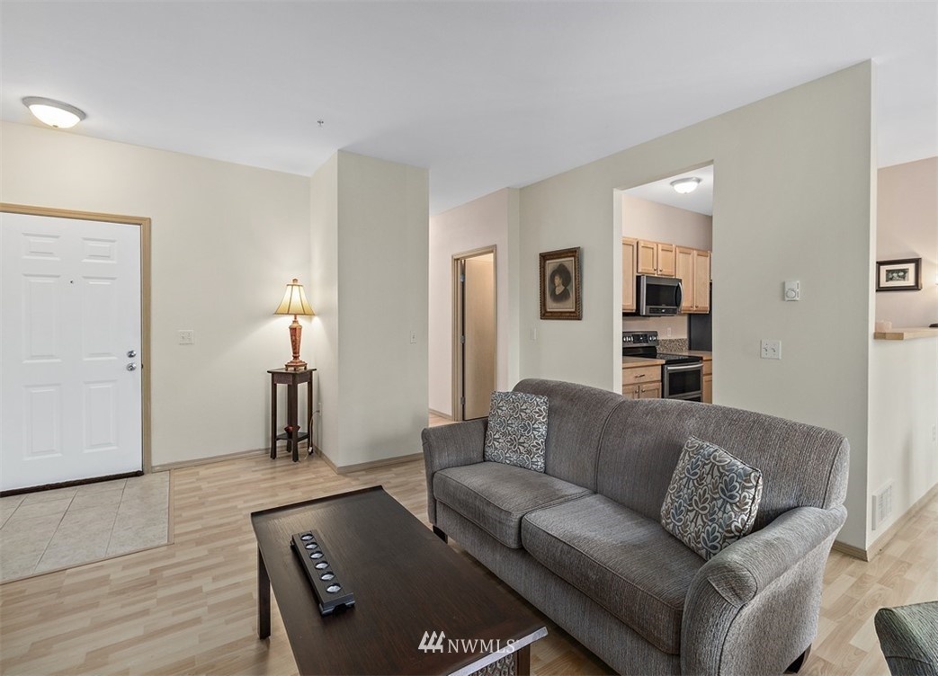 3012 Southeast 8th Place, Unit 1117 Renton, WA 98058 - Photo 5 of 40 a living room with furniture and a couch