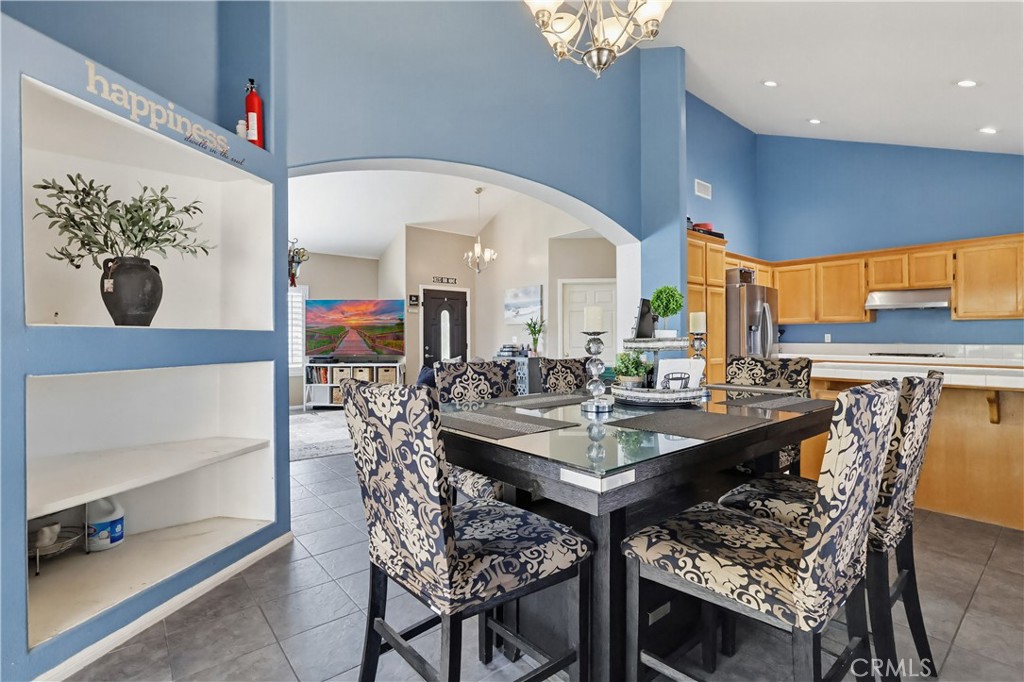 7735 Ridgeview Lane Whittier, CA 90606 - Photo 12 of 47 a view of a dining table and chairs