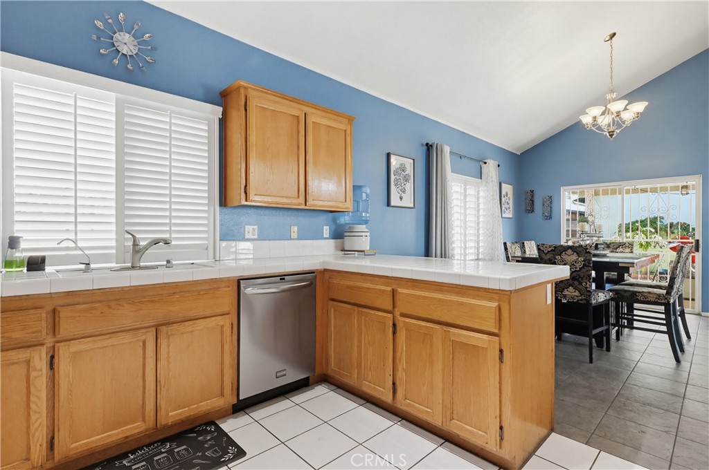 7735 Ridgeview Lane Whittier, CA 90606 - Photo 20 of 47 a kitchen with a sink cabinets and window