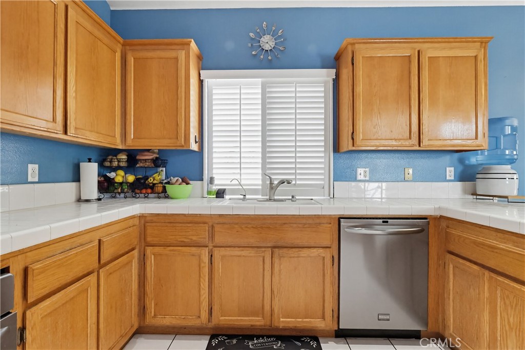 7735 Ridgeview Lane Whittier, CA 90606 - Photo 21 of 47 a kitchen with cabinets and appliances