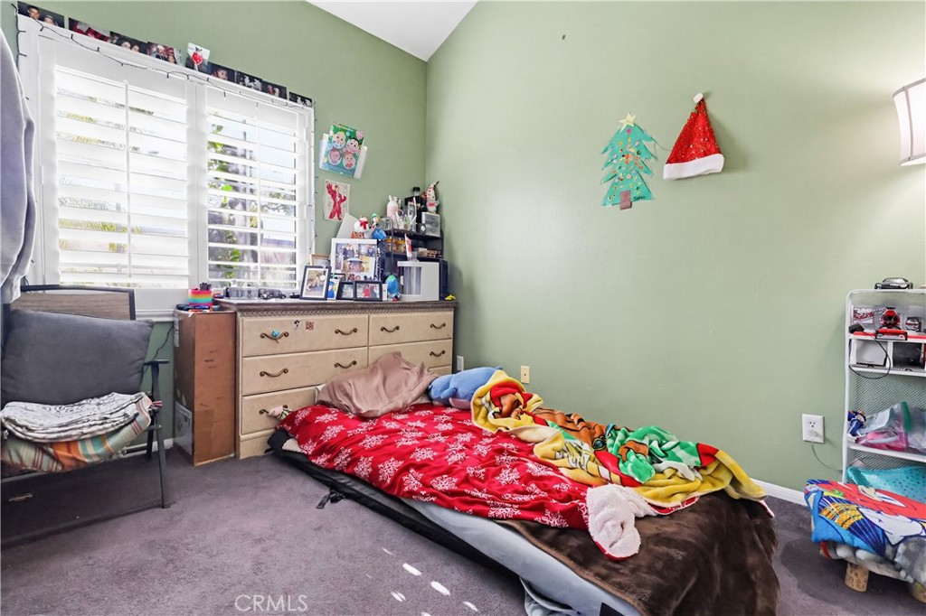 7735 Ridgeview Lane Whittier, CA 90606 - Photo 23 of 47 a bedroom with a bed and a window
