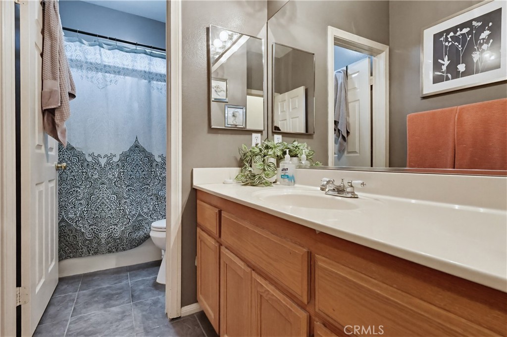 7735 Ridgeview Lane Whittier, CA 90606 - Photo 26 of 47 a bathroom with a sink and a mirror